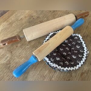 Vintage rolling pins and hotpad/potholder blues and browns